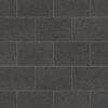 Procida limestone luxury vinyl tiles in dark charcoal with subtle aggregate pattern